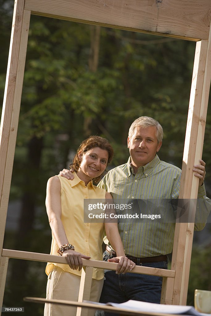 Couple standing at construction site