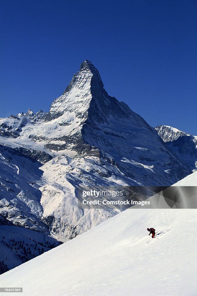 Skier in front of Matterhorn, Zermatt, Switzerland