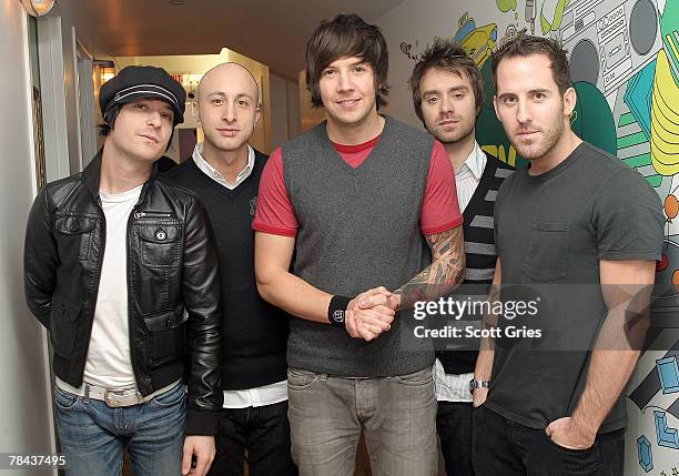 David Desrosiers, Jeff Stinco, Pierre Bouvier, Sebastien Lefebvre, and Chuck Comeau of Simple Plan pose for a photo backstage during MTV's Total...