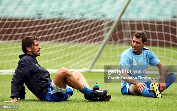 New Sydney Captain Tony Popovic talks with old Sydney Captain Mark Rudan during a training session with Sydney FC at the Sydney Football Stadium on...