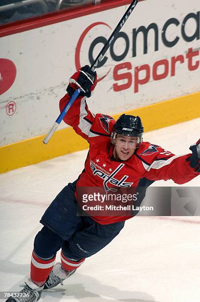 Mike Green of the Washington Capitals celebrates scoring over time goal during a hockey game against the New York Rangers on December 12, 2007 at the...