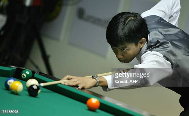 Lee Vann Corteza from Philippine competes during the pool 9 ball men's singel quarter-final at the 24th Southeast Asian Games in Korat, 13 December...