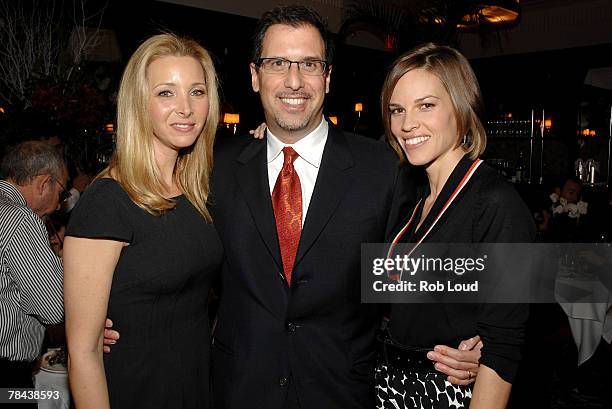 Actress Lisa Kudrow, director Richard LaGravenese, and actress Hilary Swank pose at a luncheon for "P.S. I Love You" at Brasserie Ruhlmann on...