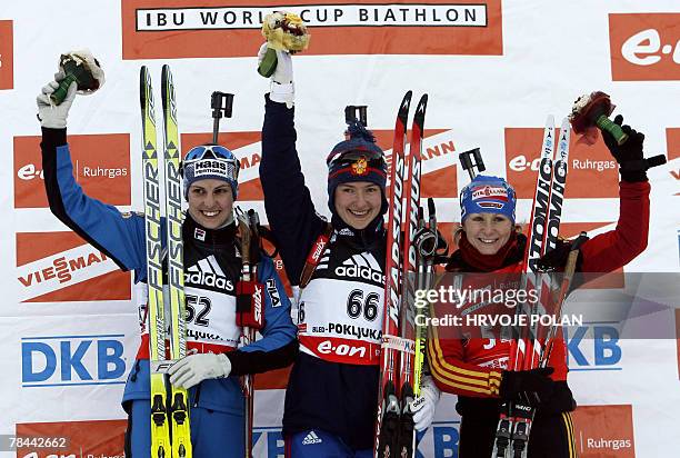 Ekaterina Iourieva of Russia celebrates her victory, next to second placed Michela Ponza of Italy and third Martina Glagow of Germany on the podium...