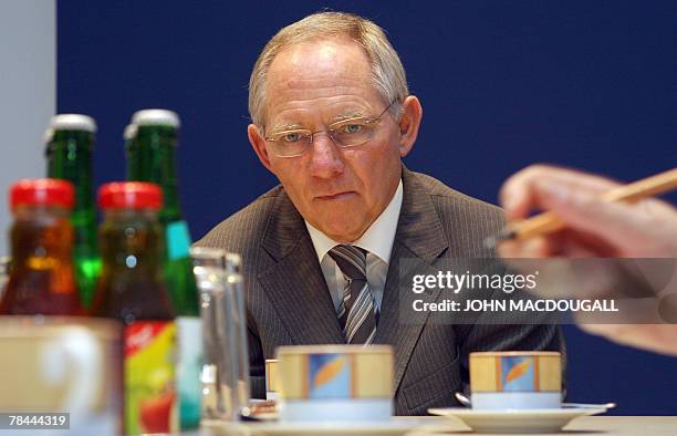 German Interior Minister Wolfgang Schaeuble speaks to AFP journalists during an exclusive interview at the agency's German headquarters in Berlin 12...