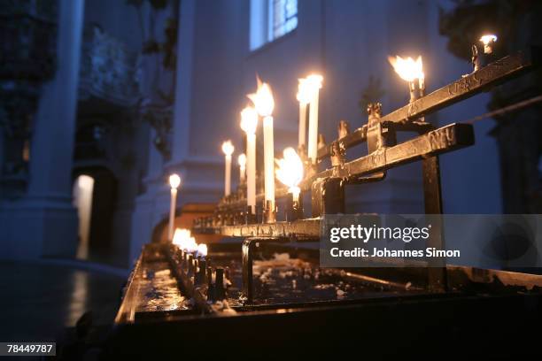 Candles burn inside the UNESCO world heritage site of the baroque Wieskirche Church on December 13, 2007 in Wildsteig, Germany. Snowfall brought...