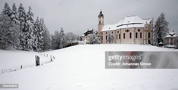 Snow covers the landscape around the UNESCO world heritage site of the baroque Wieskirche Church on December 13, 2007 in Wies, Germany. Snowfall...