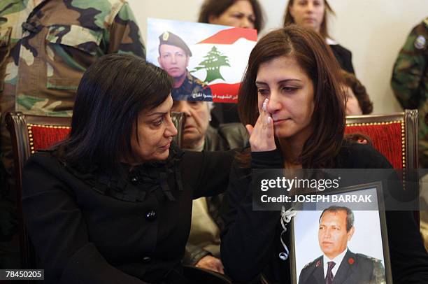 Wafaa Sleiman , wife of Lebanese army commander and presidential candidate Michel Sleiman, comforts Rasha, daughter of assassinated Brigadier General...