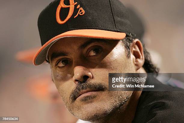 Rafael Palmeiro of the Baltimore Orioles watches from the dugout as his team plays against the Toronto Blue Jays August 12, 2005 at Oriole Park at...