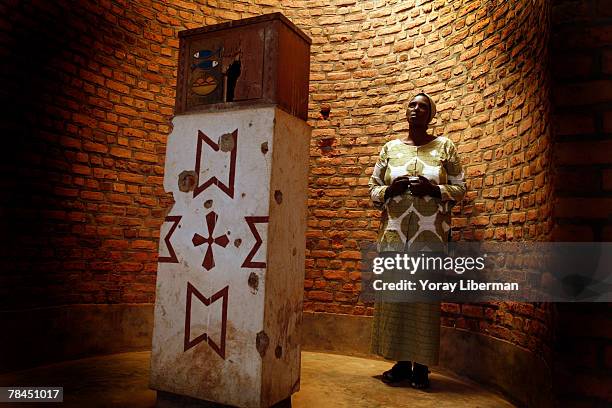 Muka Musoni Serafine poses in the church of Nyamata where a massacre took place on April 11, 1994 during the Rwanda genocide on April 24, 2007 in...