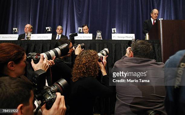 Photographers look on as Former Senator George J. Mitchell , the lead investigator in Major League Baseball's steroid scandal, speaks about the...
