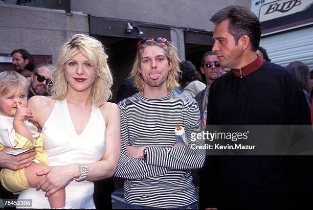 Kurt Cobain of Nirvana with wife Courtney Love and daughter Frances Bean Cobain and Peter Gabriel