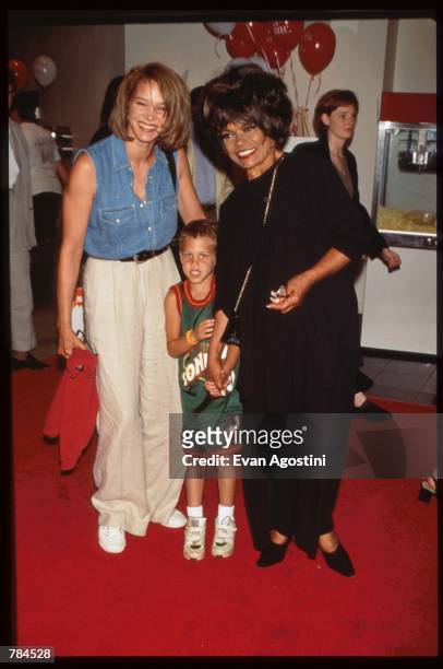 Eartha Kitt stands with her daughter and grandson at the premiere of "Harriet the Spy" July 9, 1996 in New York City. The film is based on the...
