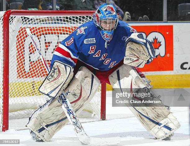 Josh Unice of the Kitchener Rangers gets set to make a save in a game against the London Knights on December 9, 2007 at the John Labatt Centre in...