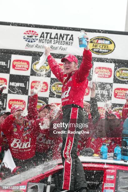 Dale Earnhardt Jr, driver of the Budweiser Chevrolet, celebrates in victory lane after winning the NASCAR Nextel Cup Series Golden Corral 500 on...