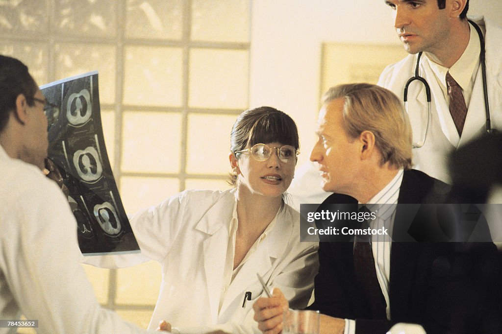 Doctors looking at scan of brain