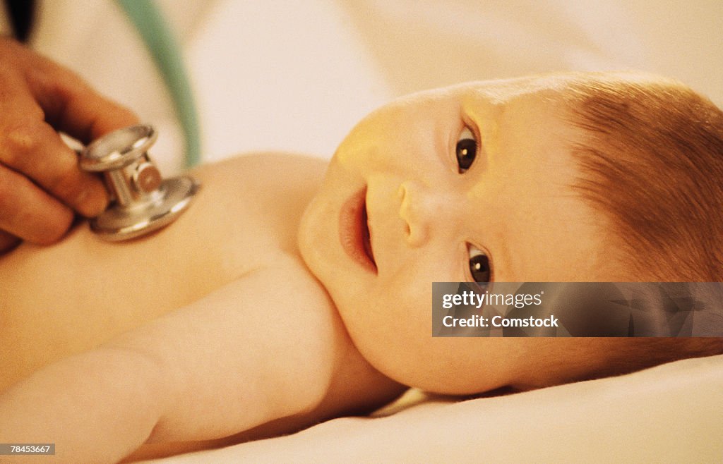 Baby being examined by doctor