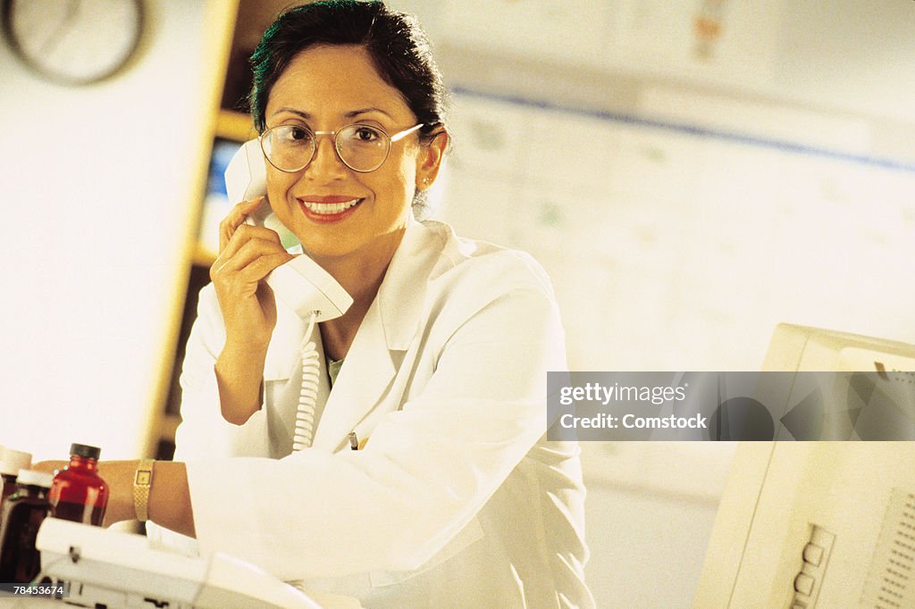 Medical professional on phone in her office