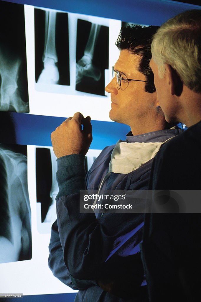 Medical professionals examining x-rays