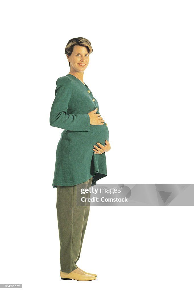 Pregnant woman posing in studio shot