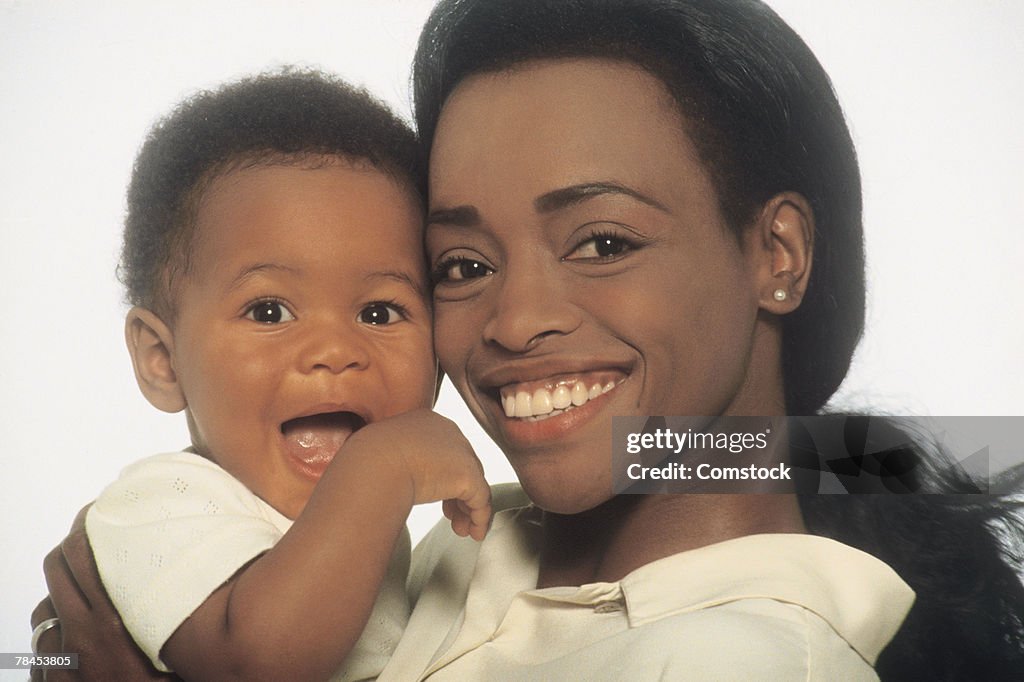 Mother and son posing for studio shot