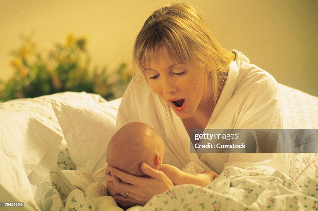 Mother and baby in bed