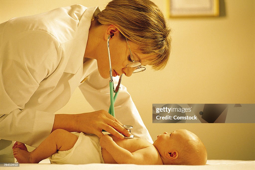 Doctor examining baby