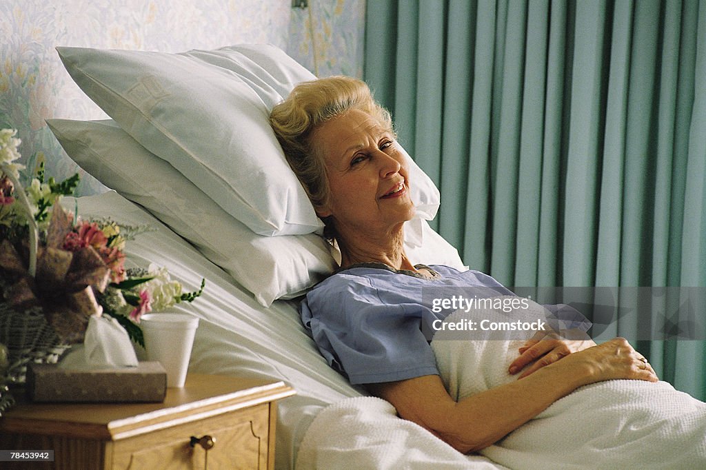 Senior woman in hospital bed