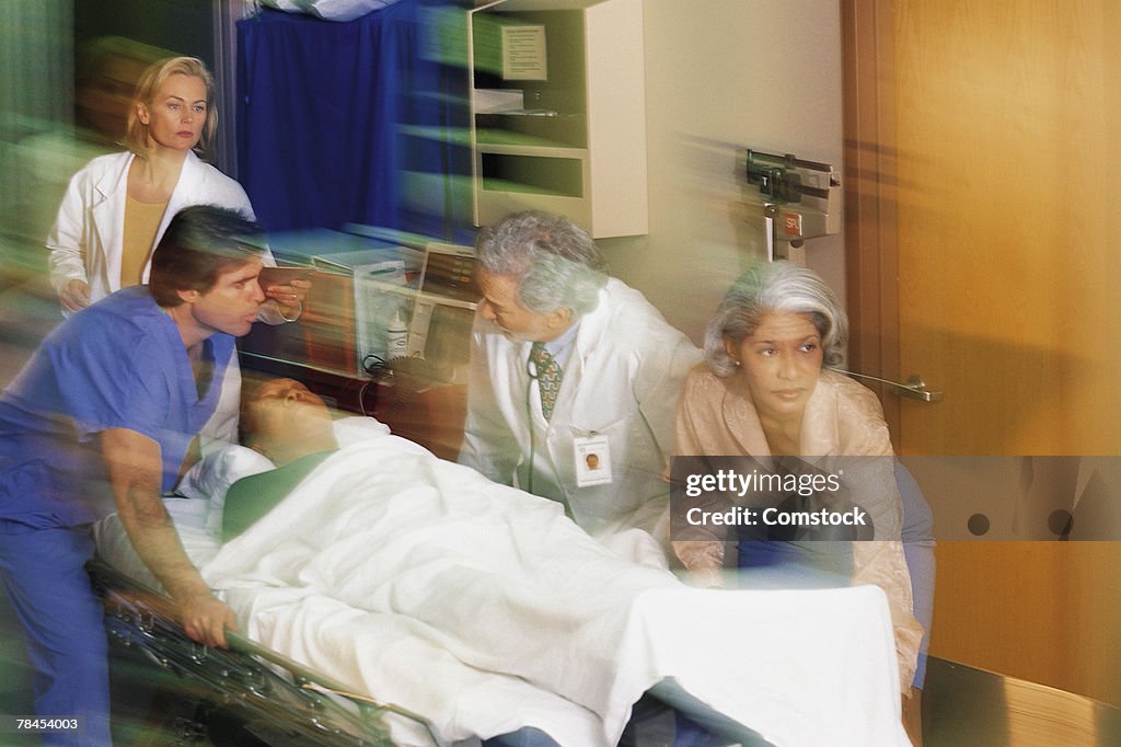 Patient Rushed Doctors Rushing Patient Into Emergency Room High-Res Stock Photo ...