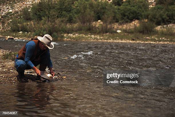 man panning for gold on the south platte river - sifting stock pictures, royalty-free photos & images
