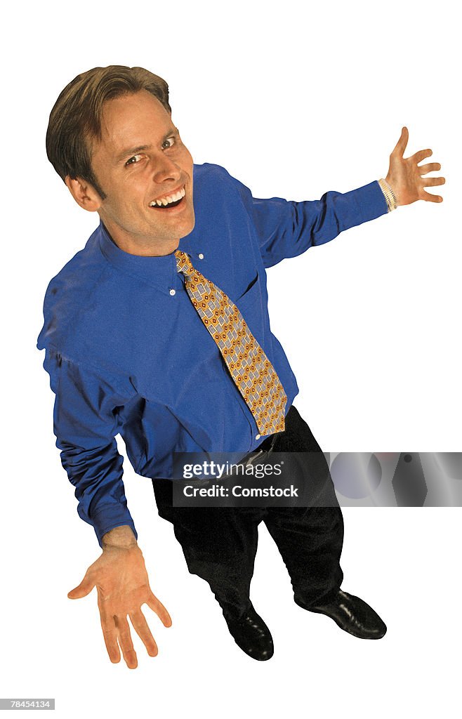 Businessman smiling with arms open