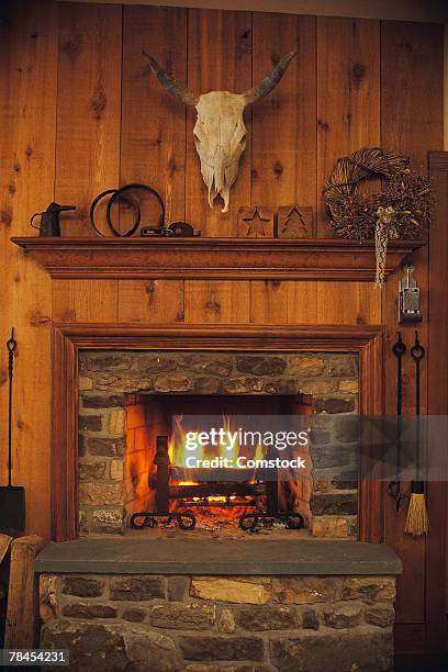 fireplace and mantle in rustic western lodge - cabin stock pictures, royalty-free photos & images