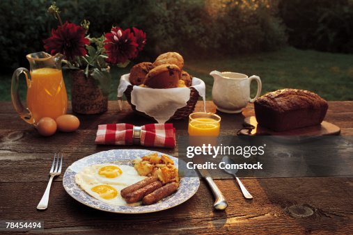 Breakfast on rustic table outdoors Breakfast on rustic table outdoors
