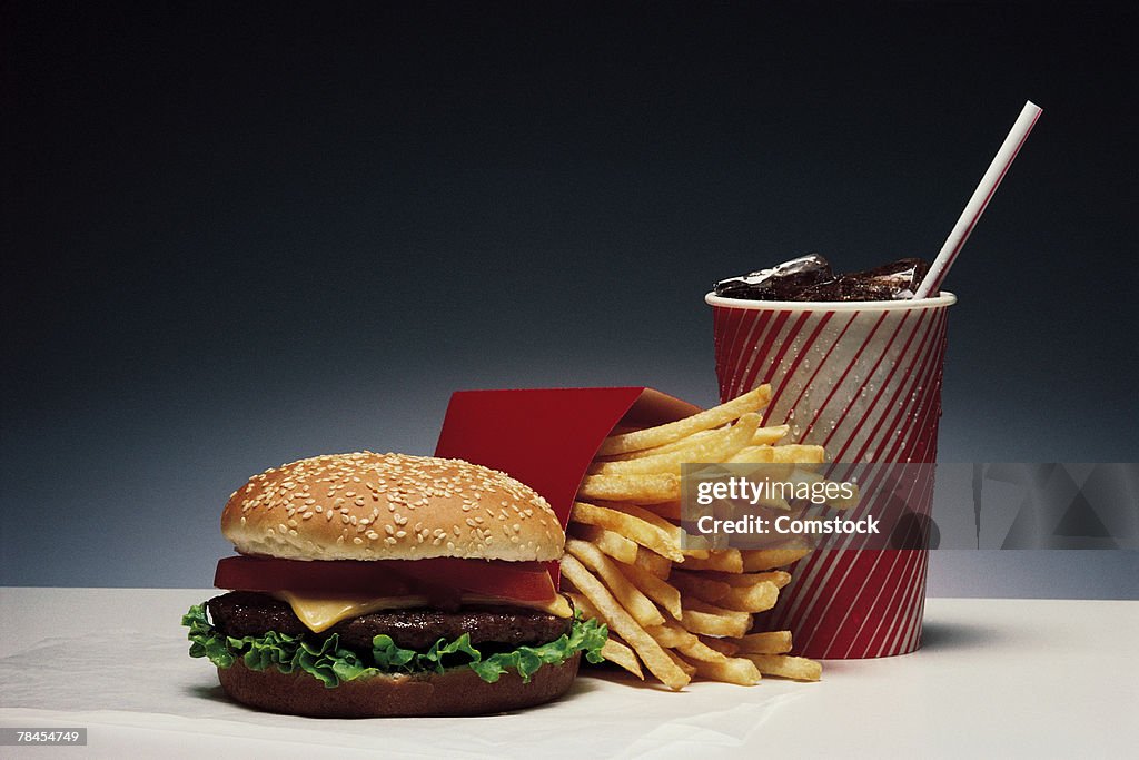 Burger and fries with beverage