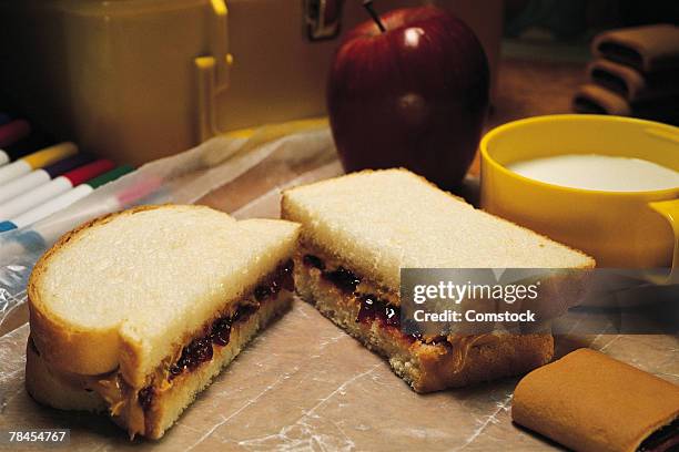 school lunch with peanut butter and jelly sandwich - peanut butter and jelly sandwich stock pictures, royalty-free photos & images