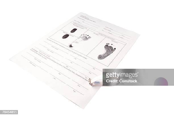 birth certificate with baby footprints - birth certificate stock pictures, royalty-free photos & images