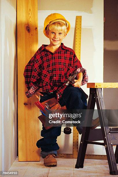 boy dressed in construction outfit - meter stick stock pictures, royalty-free photos & images