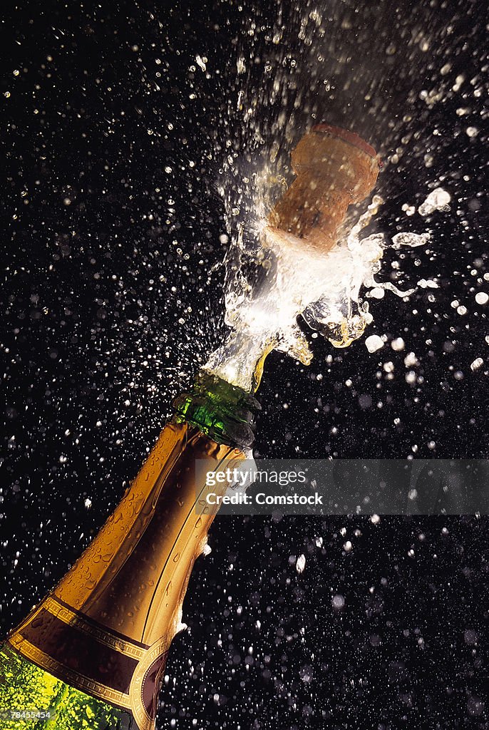 Exploding champagne bottle