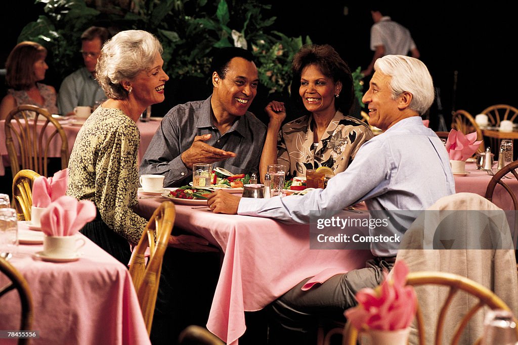 Two couples dining together