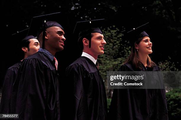 proud graduates in caps and gowns - student profile pic stock pictures, royalty-free photos & images