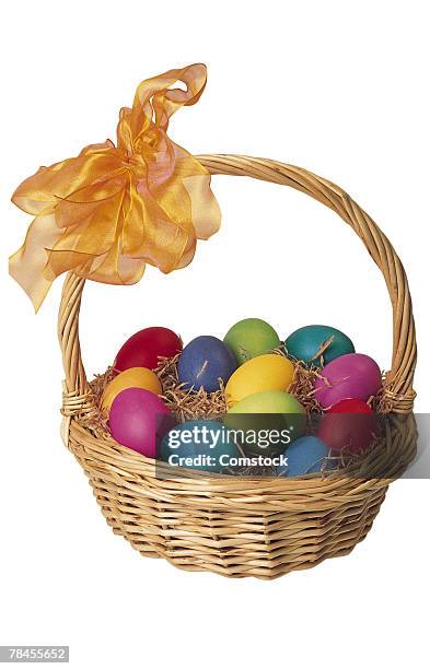 easter basket full of eggs - easter basket with candy stock pictures, royalty-free photos & images