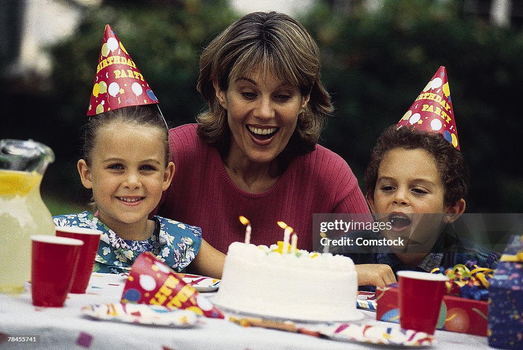 Mother with children , celebrating birthday party