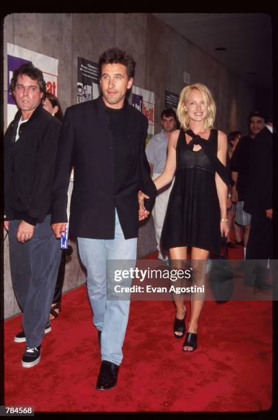 Actor Billy Baldwin walks with wife Chynna Phillips at the premiere of "Trainspotting" July 15, 1996 in New York City. This British film received a...
