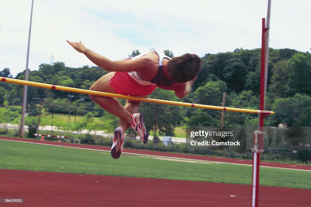 Athlete going over high jump