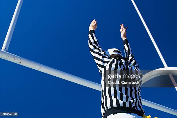 referee giving signal for successful field goal - football goal post stock pictures, royalty-free photos & images