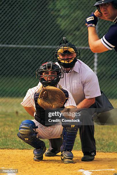 batter with catcher and umpire at home plate - backstop stock pictures, royalty-free photos & images