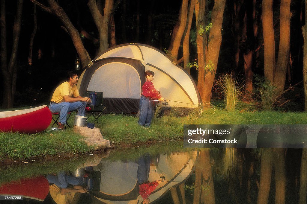 Father and son fishing and camping in Bucks County , Pennsylvania