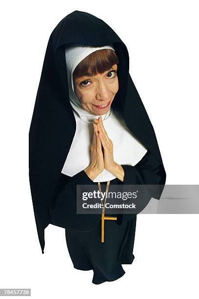 nun in praying pose - nun isolated stock pictures, royalty-free photos & images