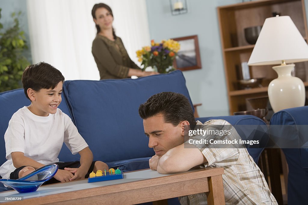 Father and son playing