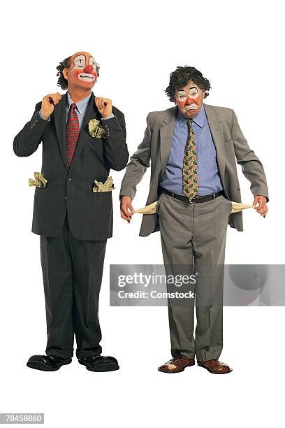 rich clown and poor hobo - sad clown stock pictures, royalty-free photos & images